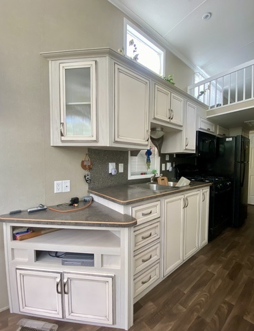 2-292 Woodhaven Sublette, IL 61367 - Photo 15 of 25 a kitchen with stainless steel appliances granite countertop a sink stove and cabinets