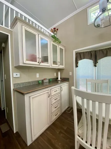 a kitchen with a stove a sink and a refrigerator