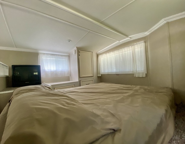 2-292 Woodhaven Sublette, IL 61367 - Photo 23 of 25 a bed room with a bed and a lamp