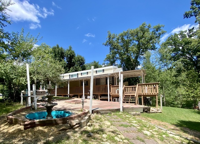 2-292 Woodhaven Sublette, IL 61367 - Photo 5 of 25 a view of a house with backyard porch and sitting area