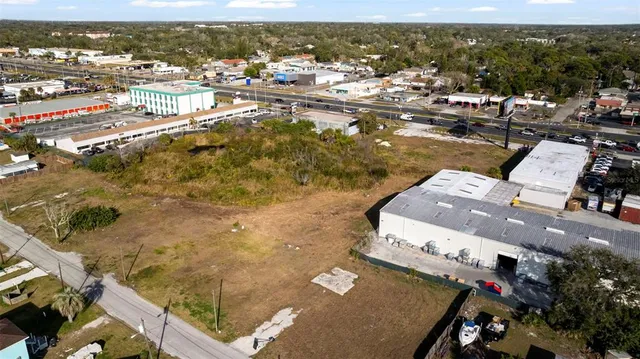 an aerial view of residential houses with city view