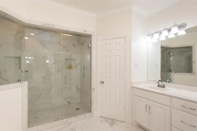 a bathroom with a shower sink and mirror
