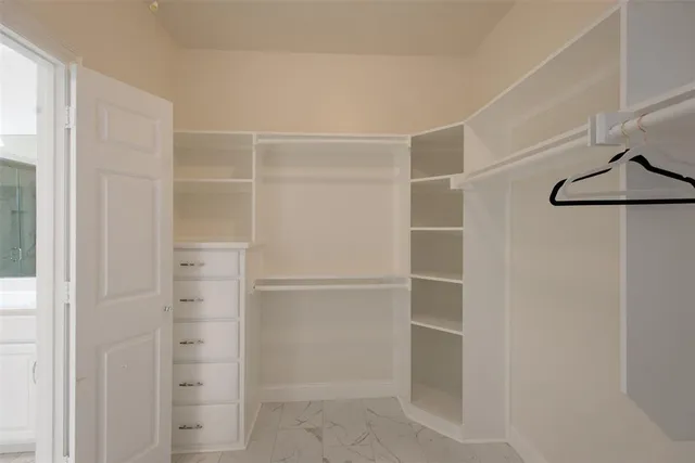 a view of an empty walk in closet