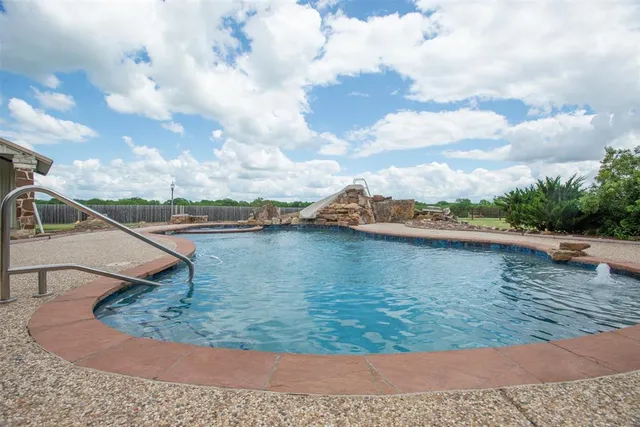 a view of a lake in middle of the house