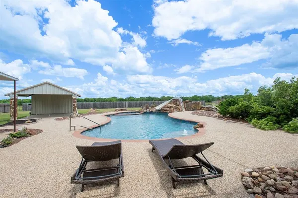 an aerial view of a house with a lake view