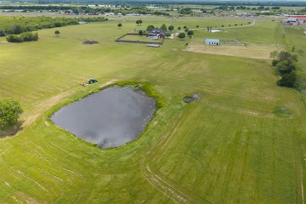 an aerial view of a house with garden space and outdoor space