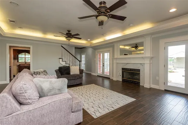 a living room with furniture and a fireplace