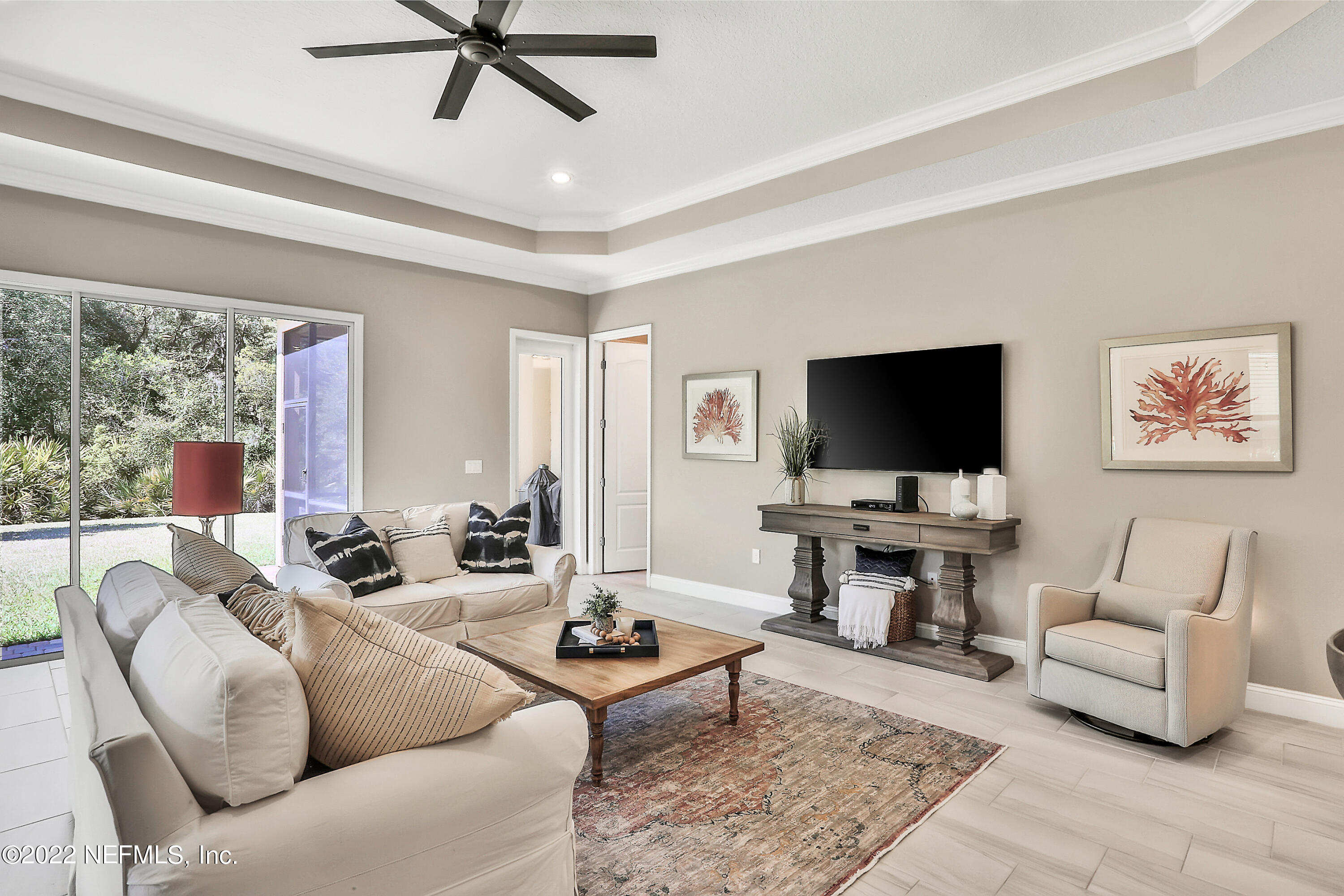 143 Barbella Circle St. Augustine, FL 32095 - Photo 18 of 95 a living room with furniture and a flat screen tv