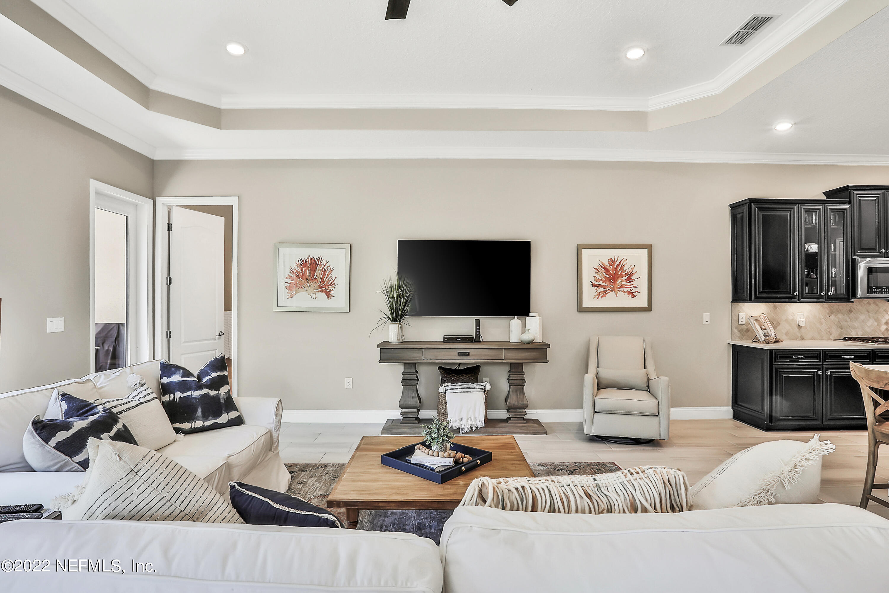 143 Barbella Circle St. Augustine, FL 32095 - Photo 20 of 95 a living room with furniture and a flat screen tv