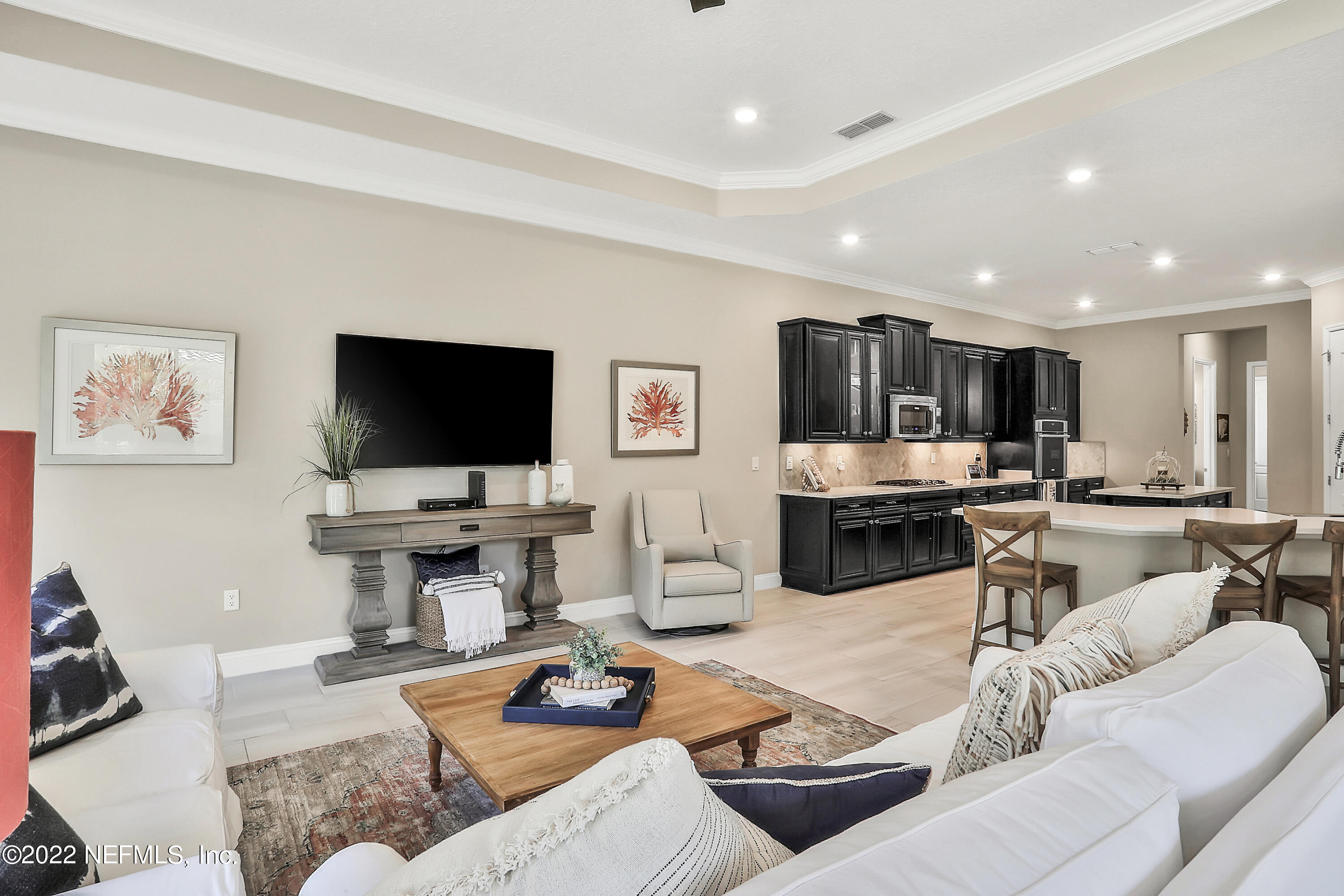 143 Barbella Circle St. Augustine, FL 32095 - Photo 22 of 95 a living room with furniture and a flat screen tv