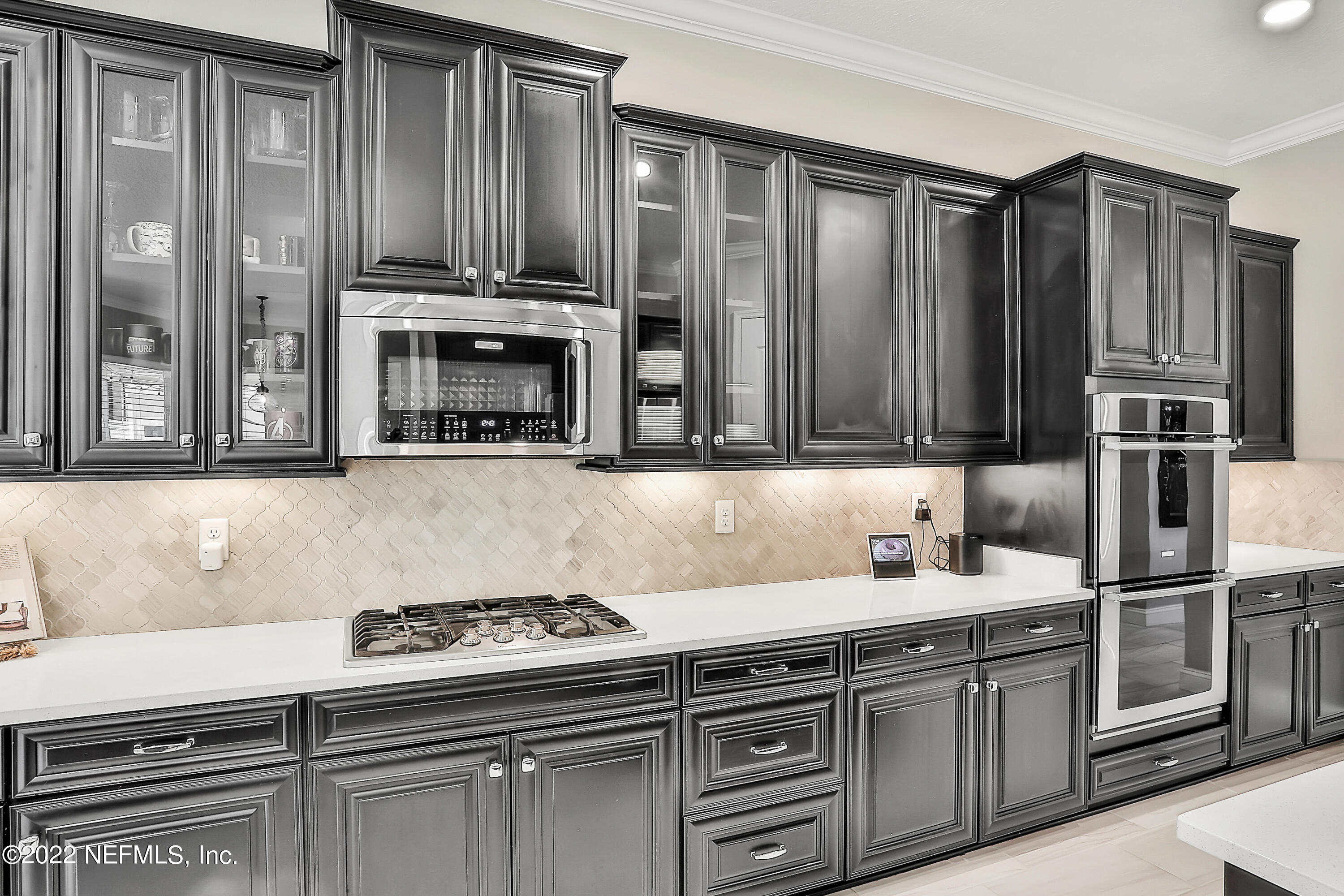 143 Barbella Circle St. Augustine, FL 32095 - Photo 28 of 95 a kitchen with stainless steel appliances granite countertop a stove and a refrigerator
