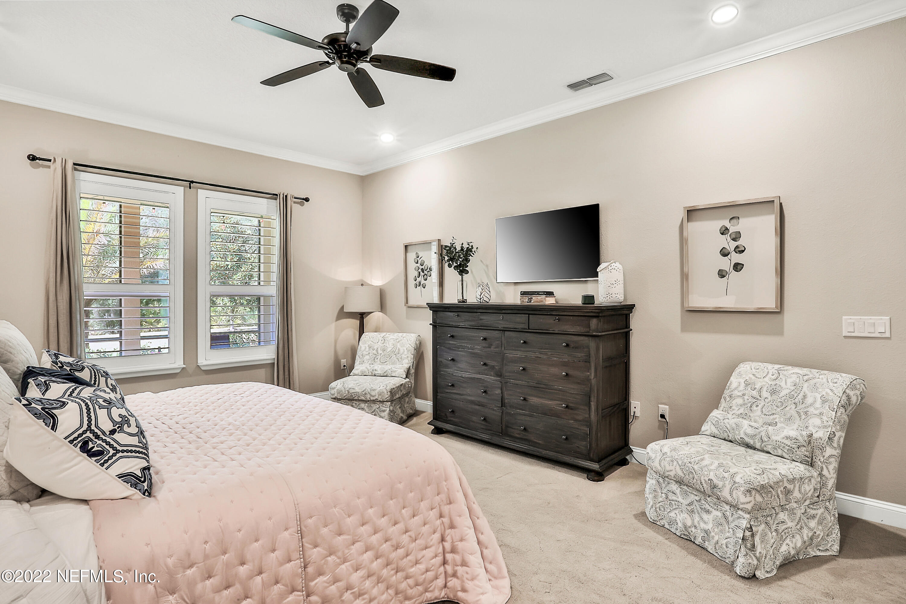 143 Barbella Circle St. Augustine, FL 32095 - Photo 30 of 95 a bedroom with a bed and furniture