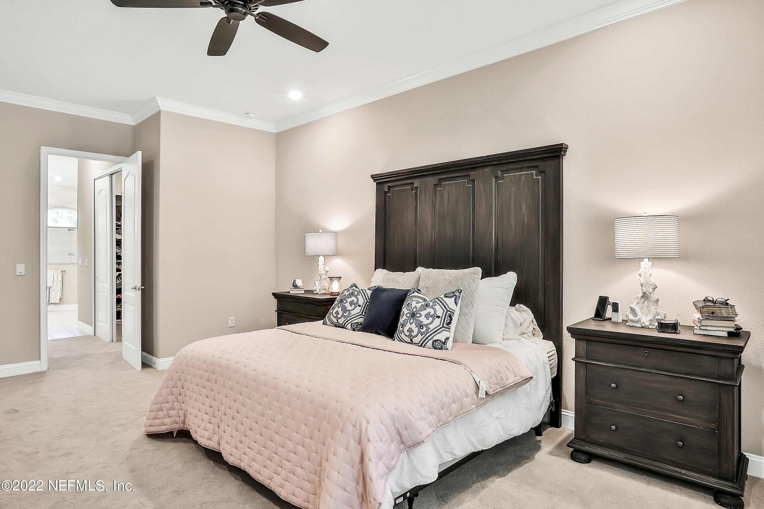 143 Barbella Circle St. Augustine, FL 32095 - Photo 31 of 95 a bedroom with a bed and ceiling fan