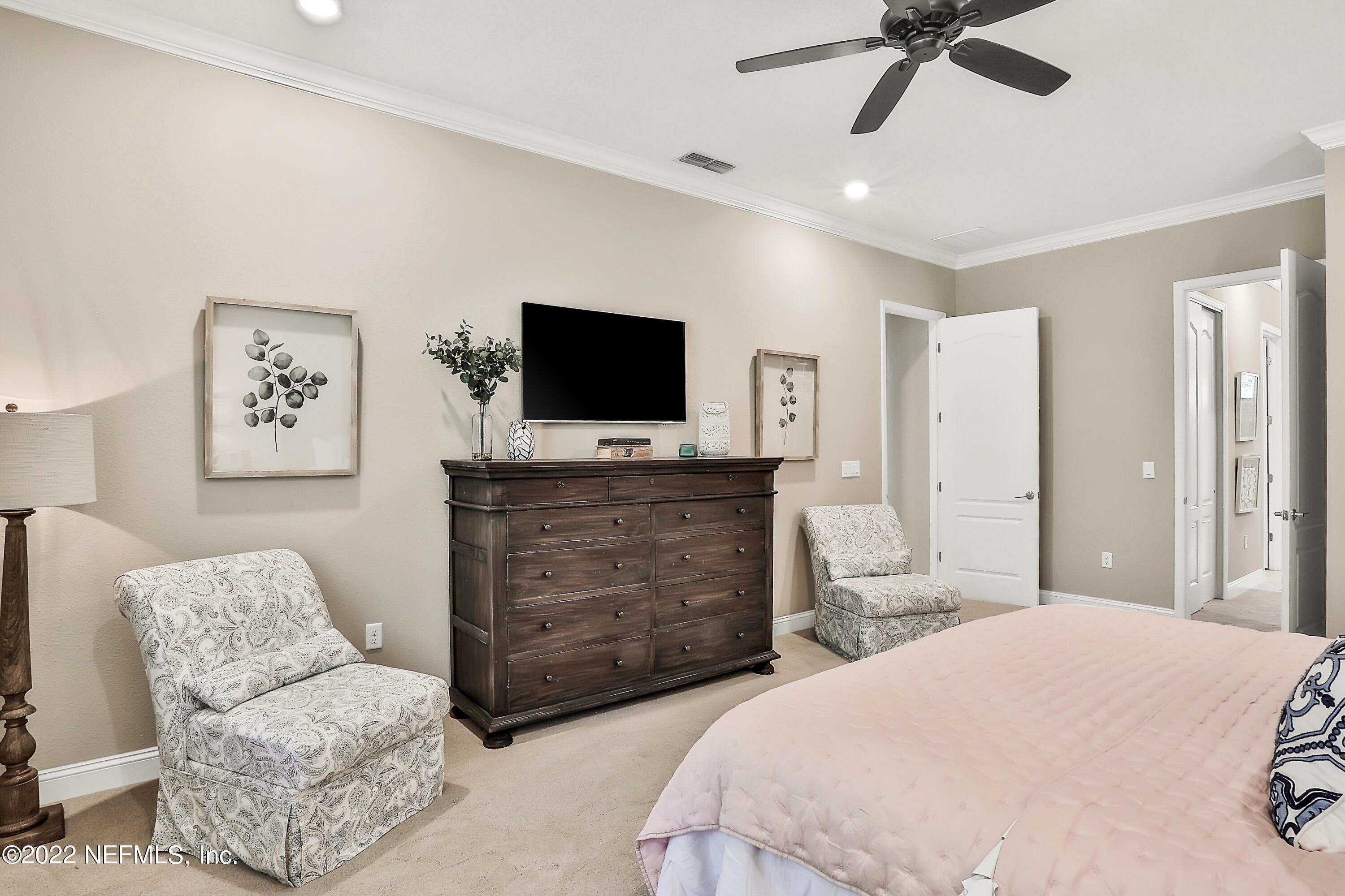 143 Barbella Circle St. Augustine, FL 32095 - Photo 32 of 95 a bedroom with a bed and a flat screen tv