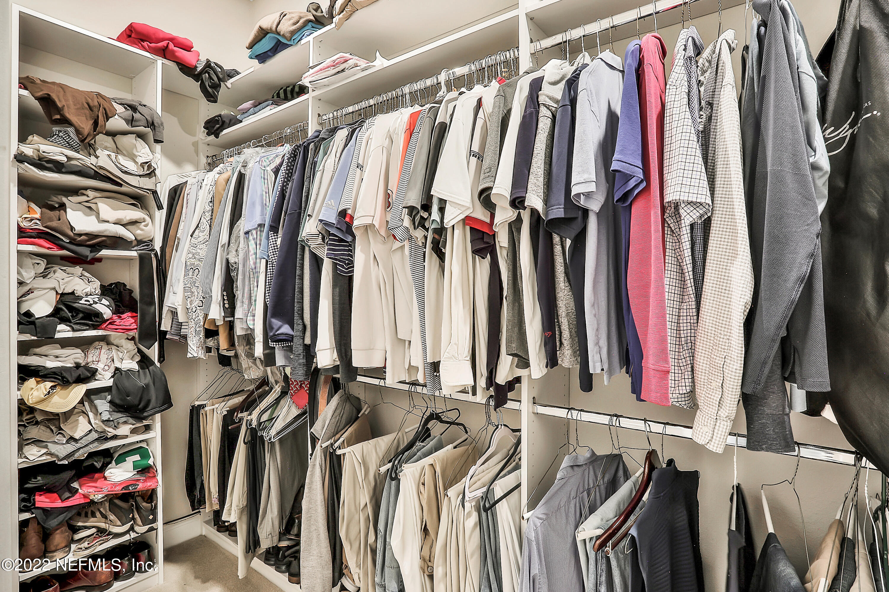 143 Barbella Circle St. Augustine, FL 32095 - Photo 38 of 95 a view of walk in closet with clothes