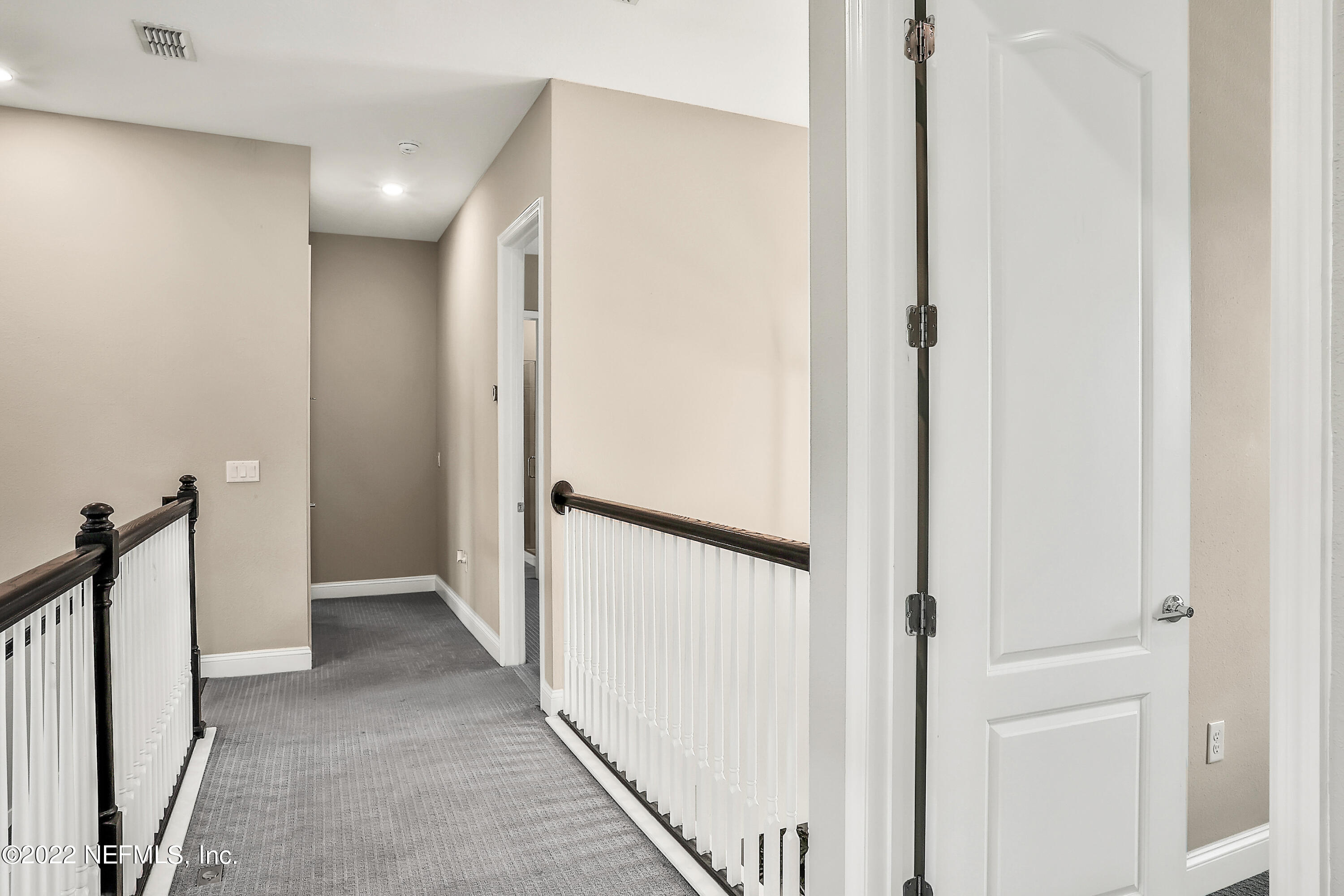 143 Barbella Circle St. Augustine, FL 32095 - Photo 39 of 95 a view of a hallway with a door and stairs