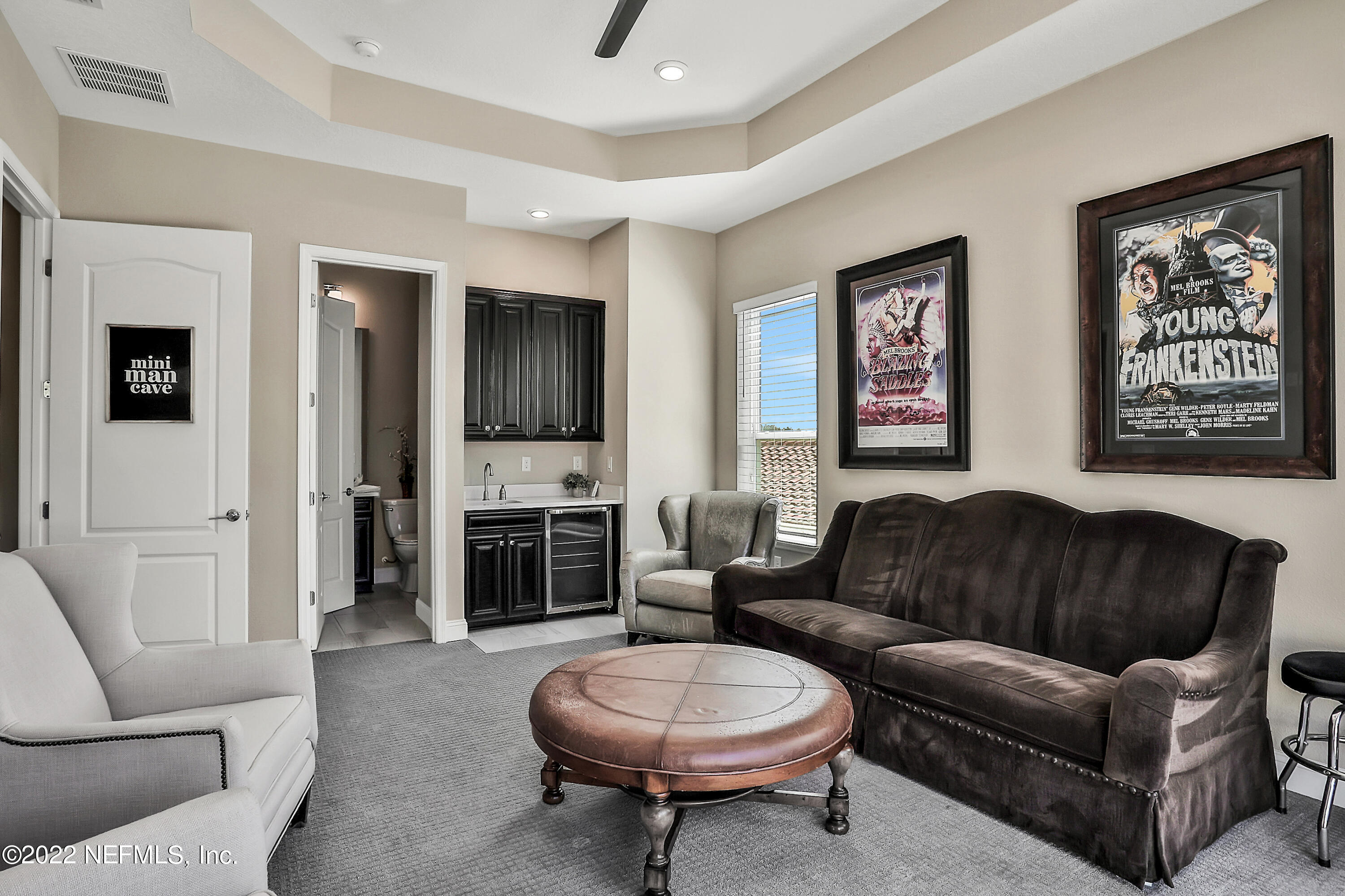 143 Barbella Circle St. Augustine, FL 32095 - Photo 41 of 95 a living room with furniture a fireplace and a flat screen tv