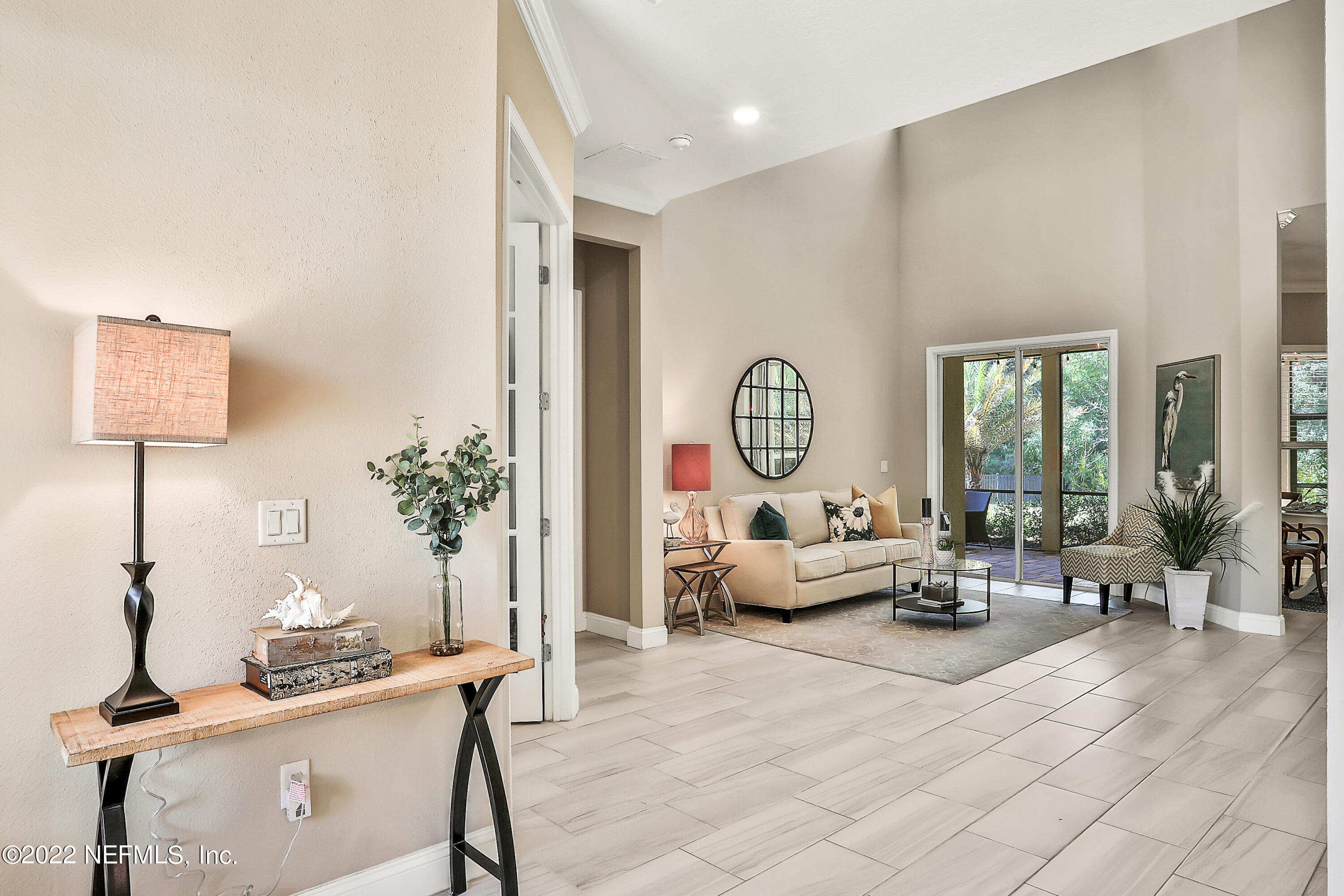 143 Barbella Circle St. Augustine, FL 32095 - Photo 6 of 95 a living room with furniture chess table and a potted plant