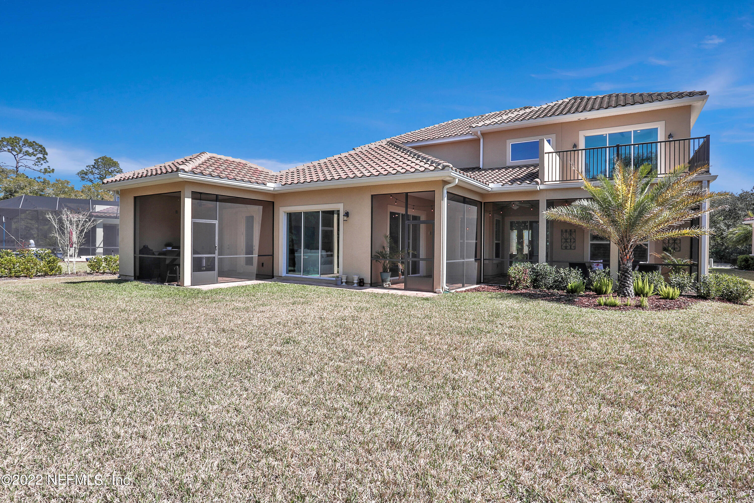 143 Barbella Circle St. Augustine, FL 32095 - Photo 63 of 95 a front view of a house with a garden