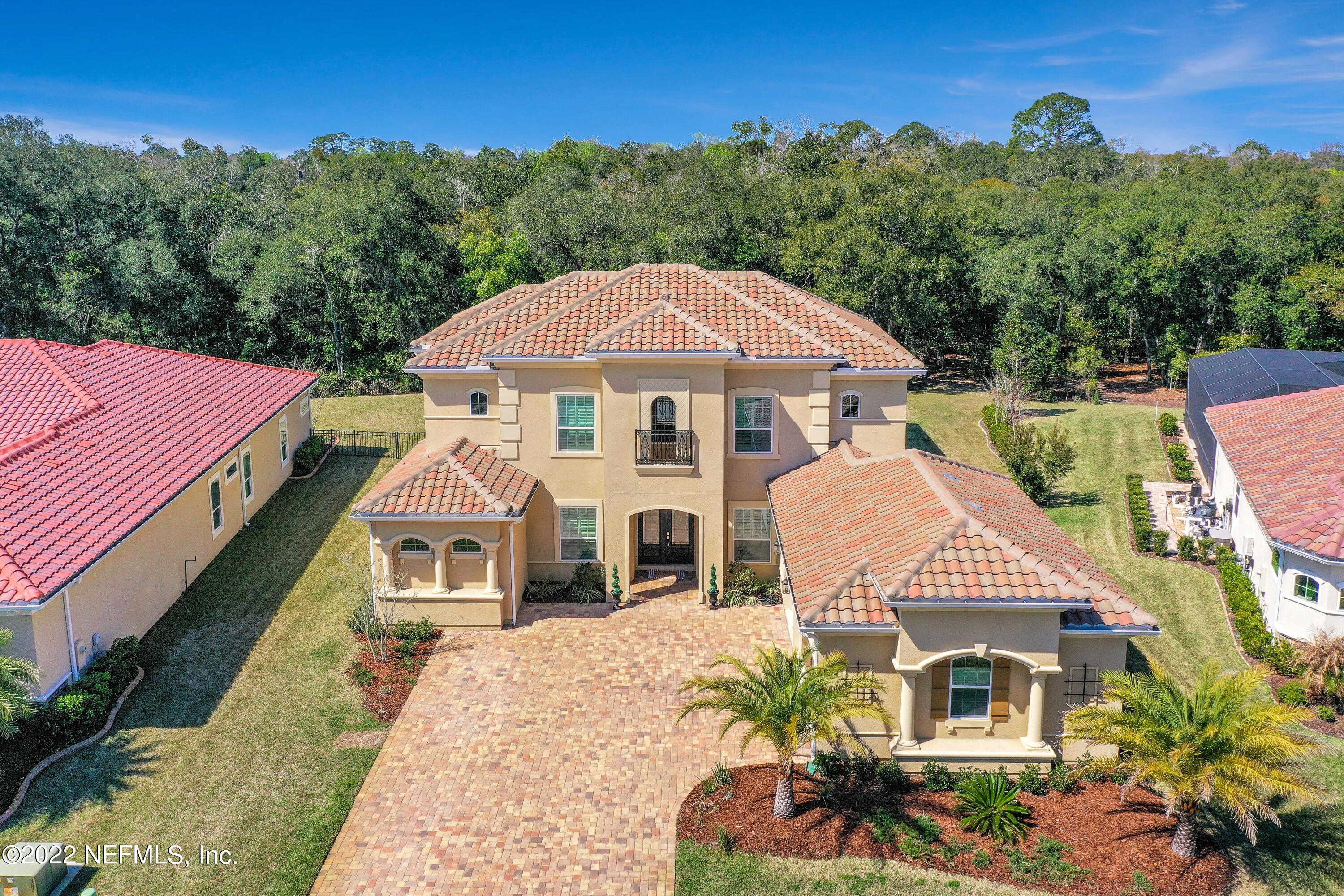 143 Barbella Circle St. Augustine, FL 32095 - Photo 67 of 95 a front view of a house with a yard and balcony