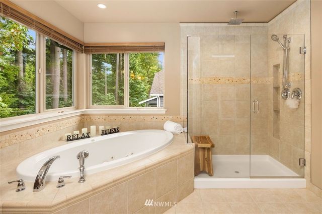 a bathroom with a tub and a sink