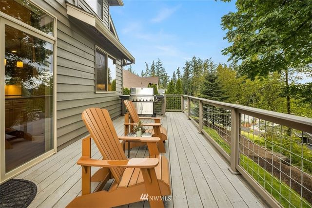 a view of a chairs on the roof deck