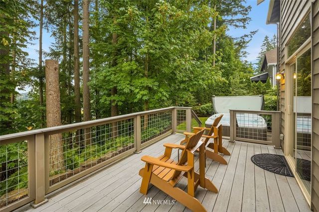 a view of a balcony with chairs
