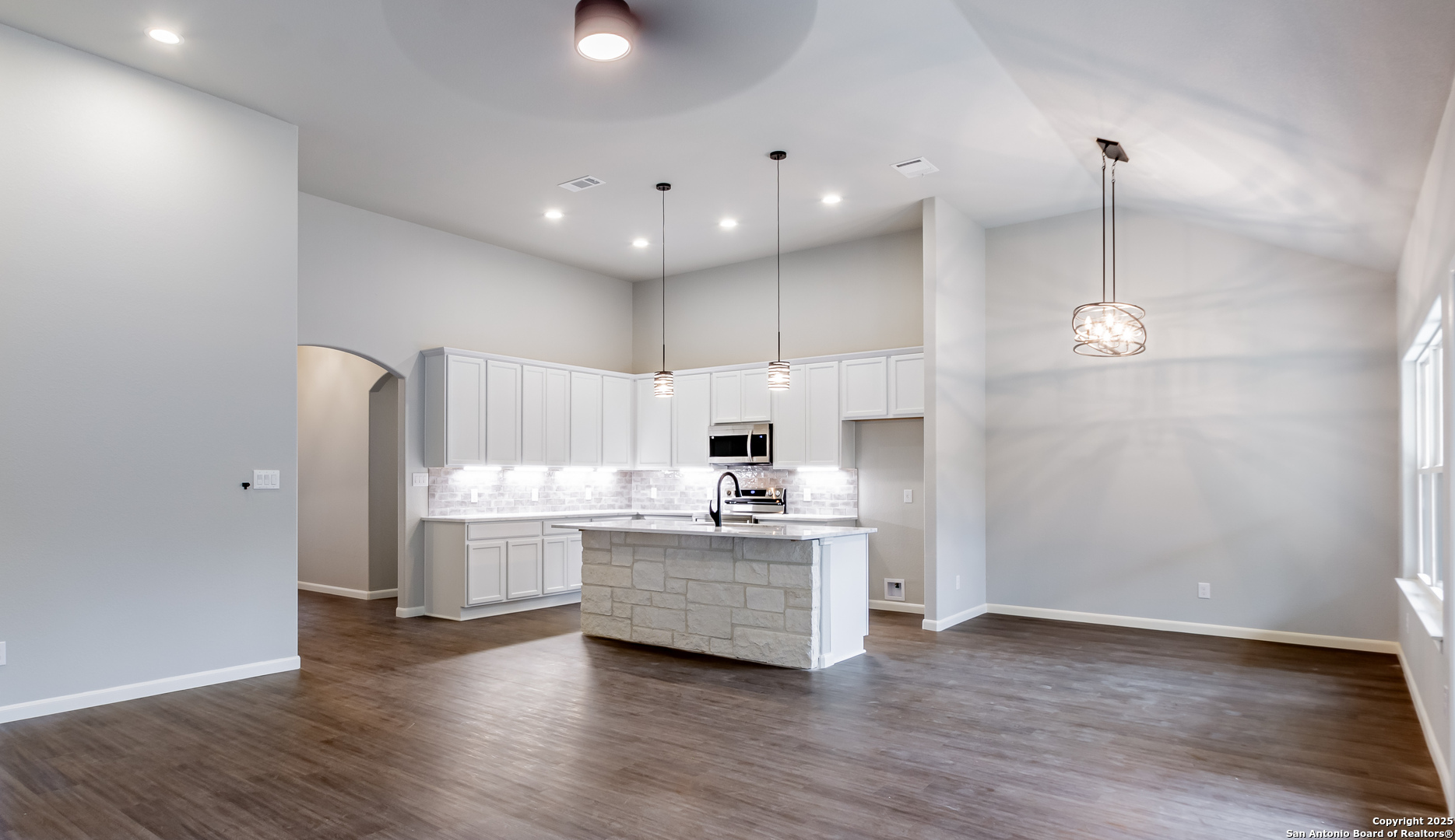 1841 Cottonwood Road Fischer, TX 78623 - Photo 14 of 45 a kitchen with kitchen island a sink and a stove top oven