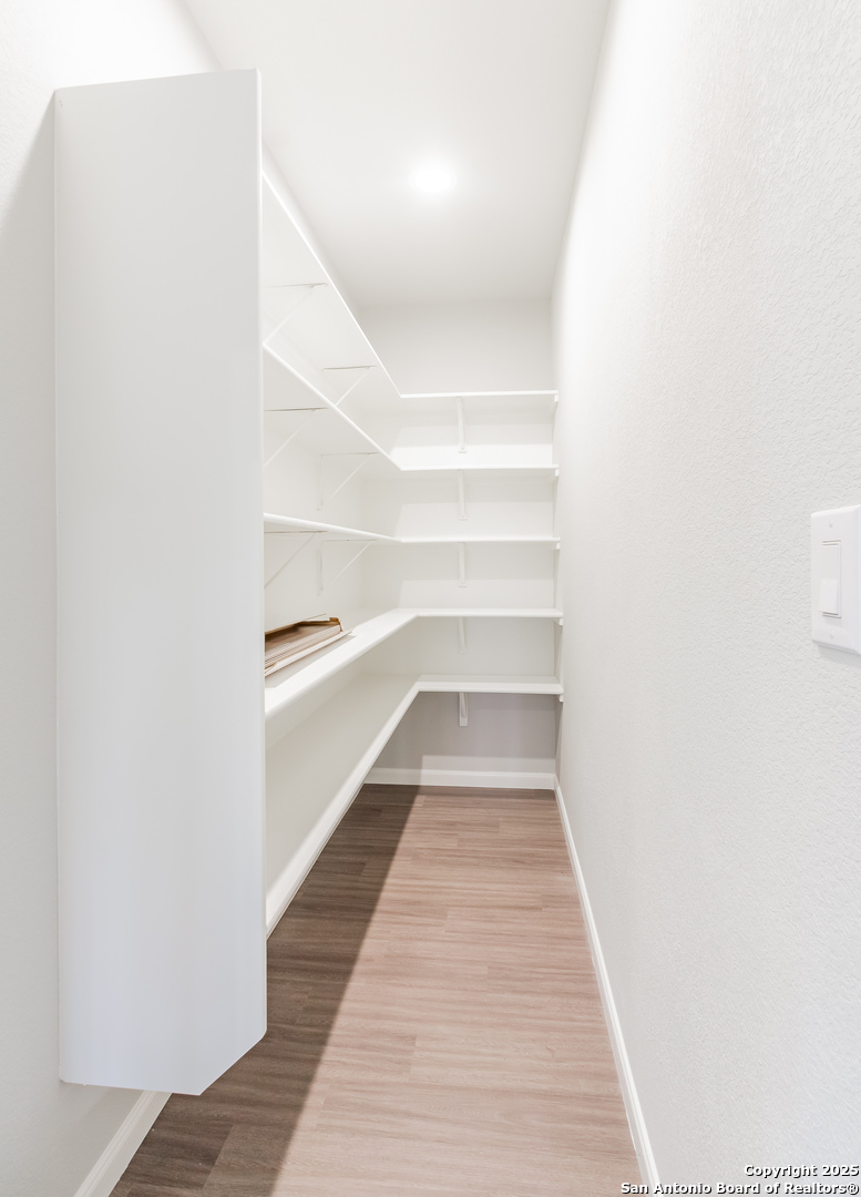 1841 Cottonwood Road Fischer, TX 78623 - Photo 18 of 45 a view of a hallway with wooden floor and entryway