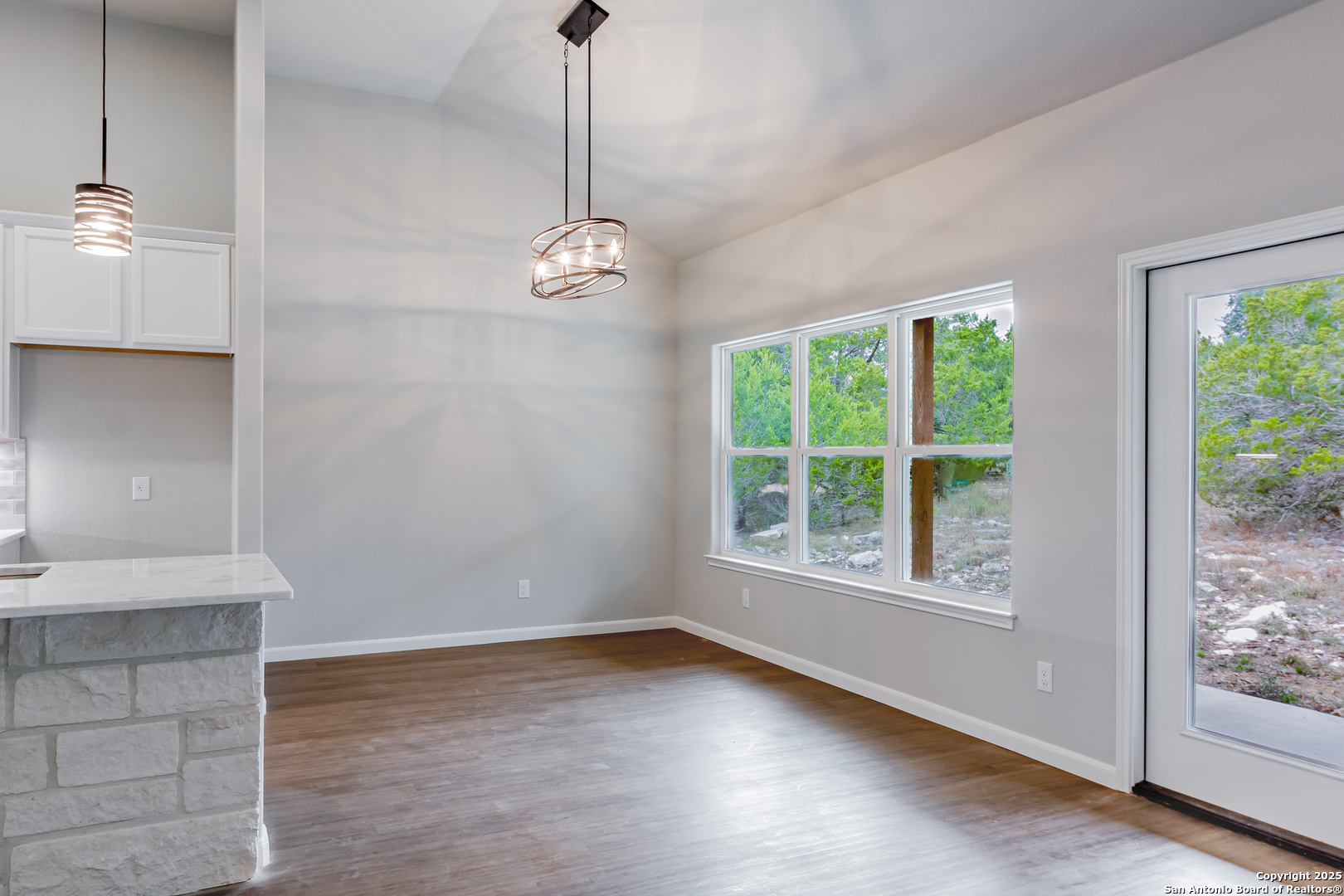 1841 Cottonwood Road Fischer, TX 78623 - Photo 20 of 45 a view of empty room with wooden floor and outdoor view