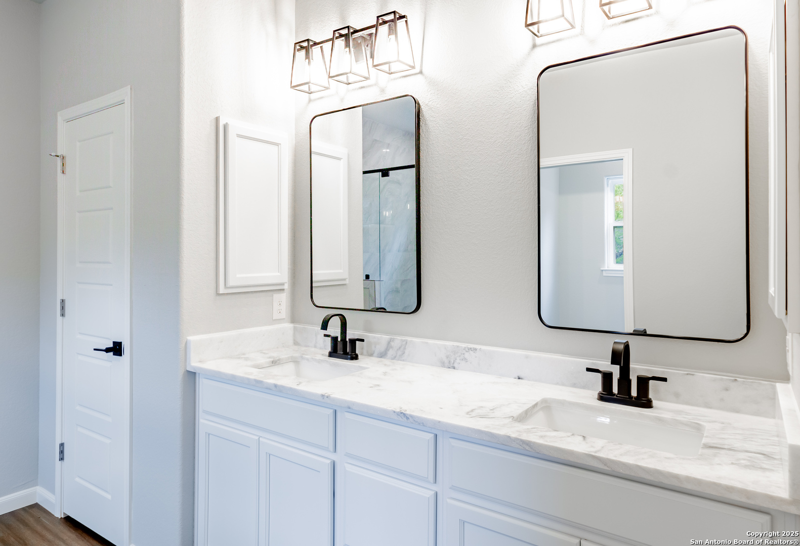 1841 Cottonwood Road Fischer, TX 78623 - Photo 28 of 45 a bathroom with double vanity sinks and two mirror