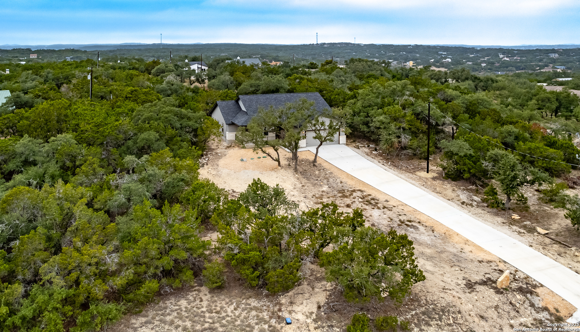 1841 Cottonwood Road Fischer, TX 78623 - Photo 4 of 45 a view of a city with lush green forest