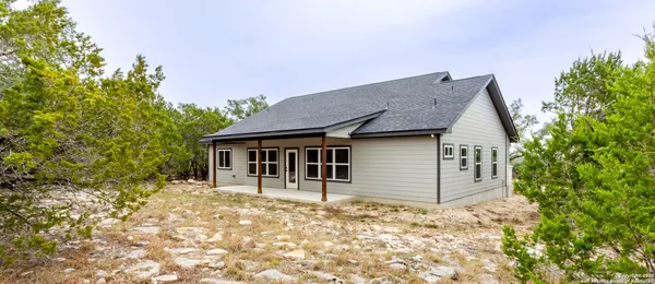 a house with trees in front of it