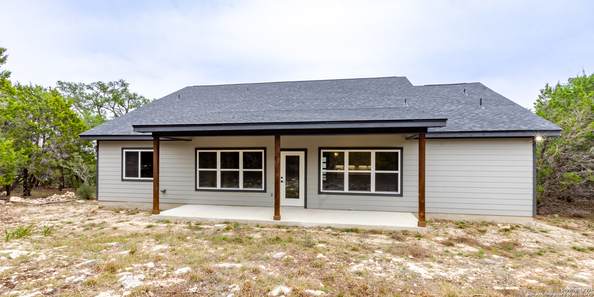 1841 Cottonwood Road Fischer, TX 78623 - Photo 43 of 45 a house with trees in the background