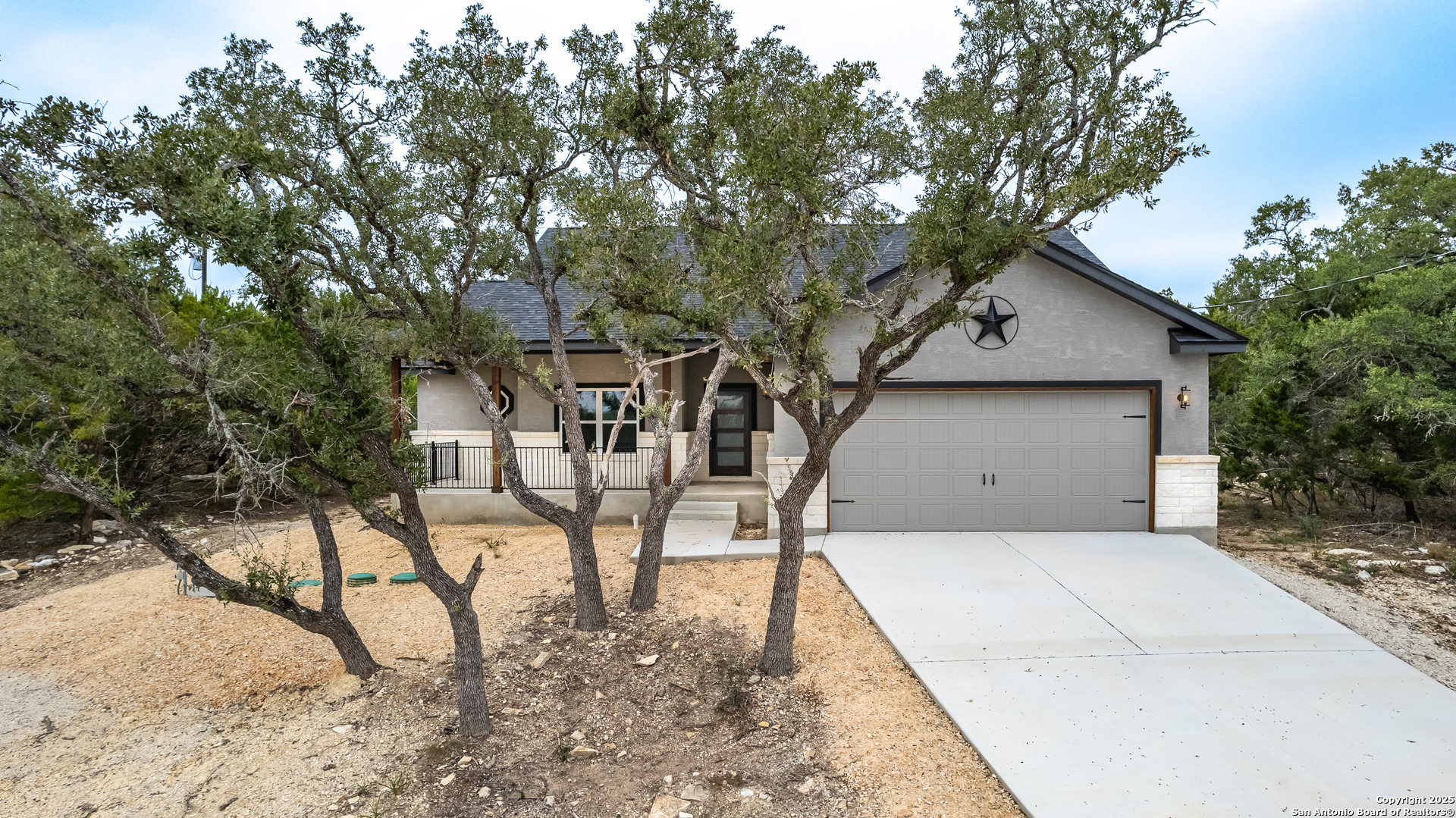 1841 Cottonwood Road Fischer, TX 78623 - Photo 7 of 45 a view of a patio with table and chairs under an umbrella