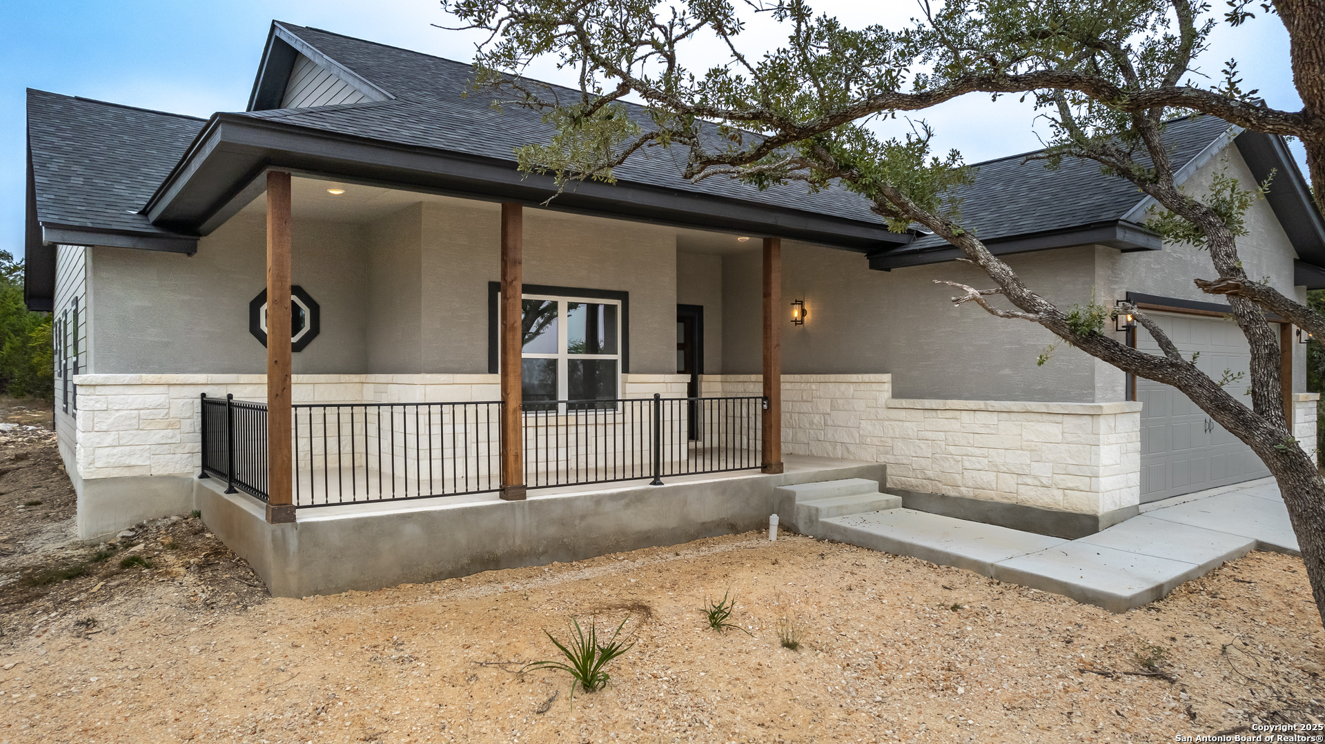 1841 Cottonwood Road Fischer, TX 78623 - Photo 8 of 45 a view of a house with a wooden fence and a large tree