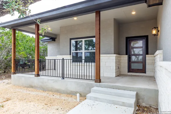 a view of a porch with wooden floor and outdoor space