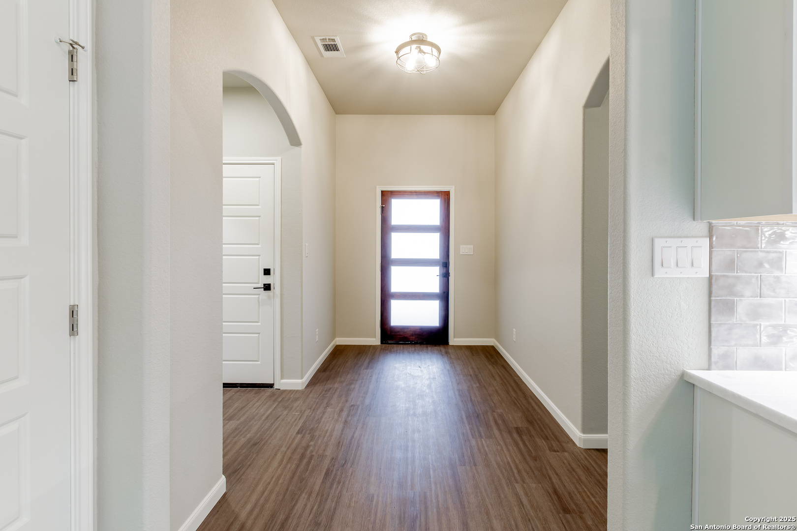 1841 Cottonwood Road Fischer, TX 78623 - Photo 10 of 45 an empty room with wooden floor and windows