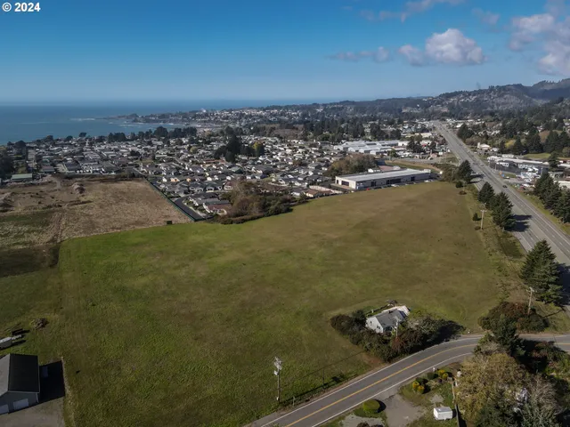 an aerial view of a residential houses with outdoor space
