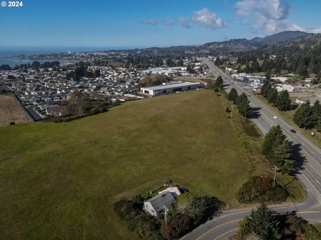 an aerial view of a houses with a yard