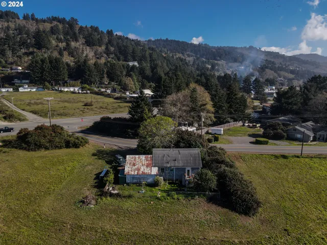 a view of a town with mountains in the background