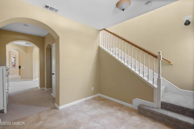 a view of a hallway view with staircase