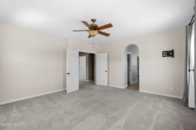 a view of a livingroom with a ceiling fan