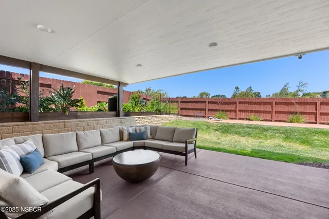 a view of a patio with couches and a table