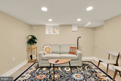 a living room with furniture and a rug