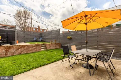a view of yard with patio