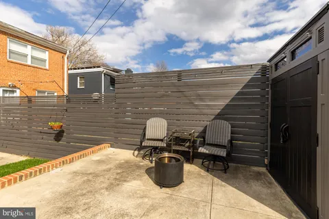 a view of a backyard with table and chairs