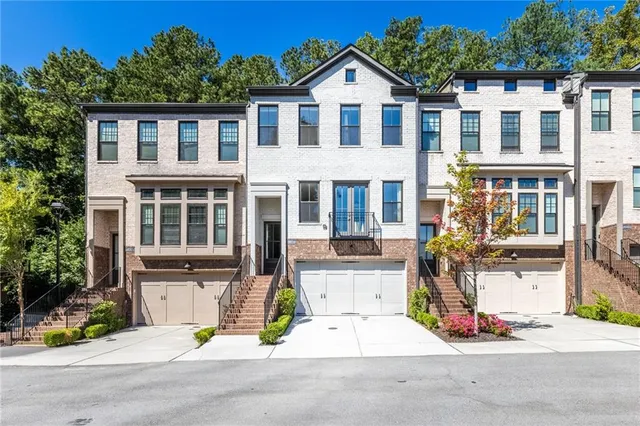 a dining room with furniture window and wooden floor