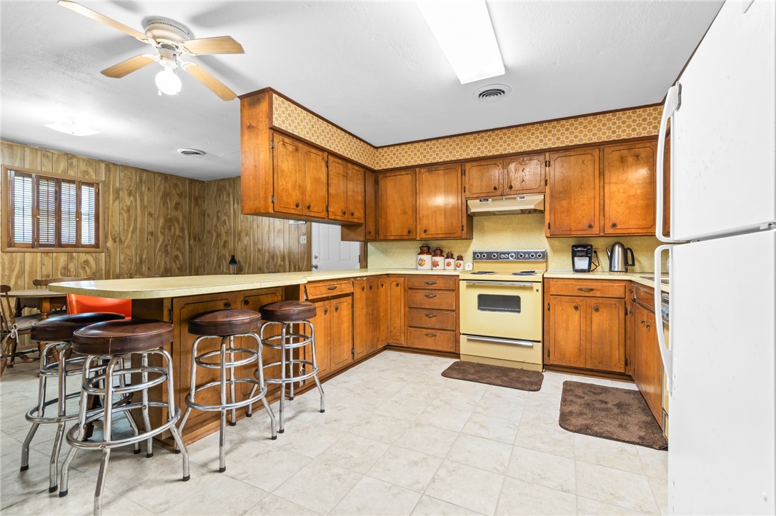 654 Lcr 654 Road Thornton, TX 76687 - Photo 48 of 64 a kitchen with stainless steel appliances granite countertop a stove and more cabinets
