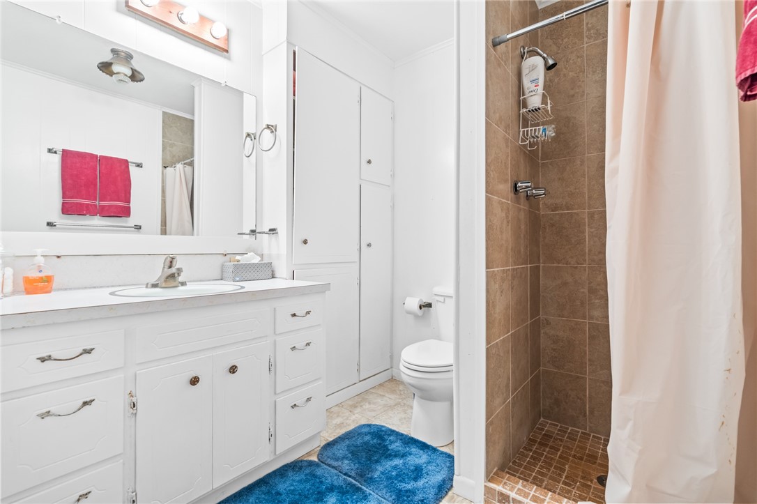 654 Lcr 654 Road Thornton, TX 76687 - Photo 54 of 64 a bathroom with a sink a toilet and shower